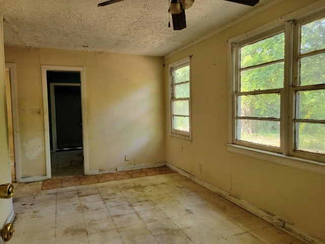3567 Morgan Dr, Macon, GA 31204 - unfurnished room featuring a ceiling fan and a textured ceiling