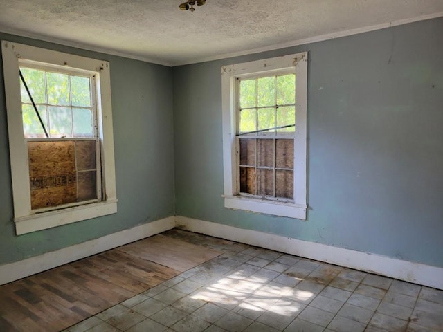 3567 Morgan Dr, Macon, GA 31204 - spare room with a textured ceiling, baseboards, and ornamental molding
