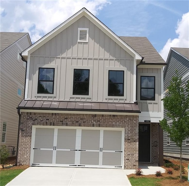 1062 Crest Mill Dr, Marietta, GA 30008 - view of front of home with brick siding, board and batten siding, and a garage