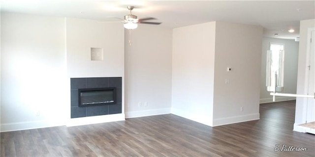 1062 Crest Mill Dr, Marietta, GA 30008 - unfurnished living room with a ceiling fan, wood finished floors, baseboards, and a fireplace
