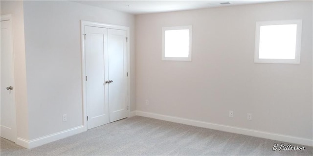 1062 Crest Mill Dr, Marietta, GA 30008 - unfurnished bedroom with light colored carpet, baseboards, and a closet