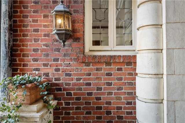 exterior details featuring brick siding