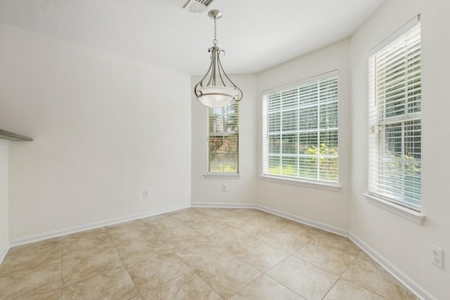 2410 Napa Valley Dr, Villa Rica, GA 30180 - unfurnished dining area featuring light tile patterned flooring and baseboards