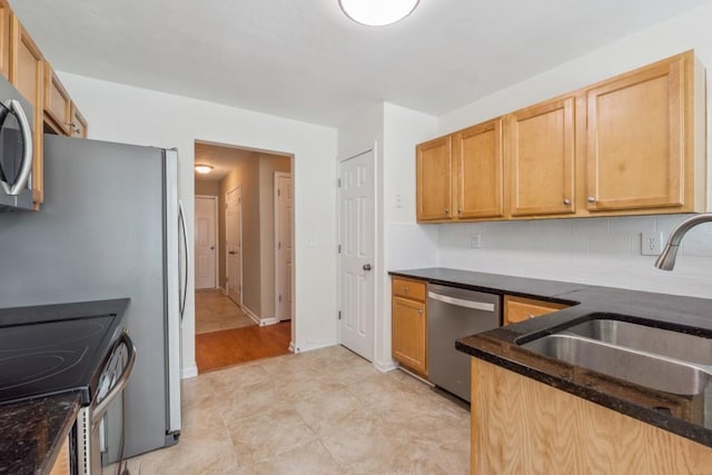 2410 Napa Valley Dr, Villa Rica, GA 30180 - kitchen with appliances with stainless steel finishes, dark stone counters, tasteful backsplash, and light tile patterned floors