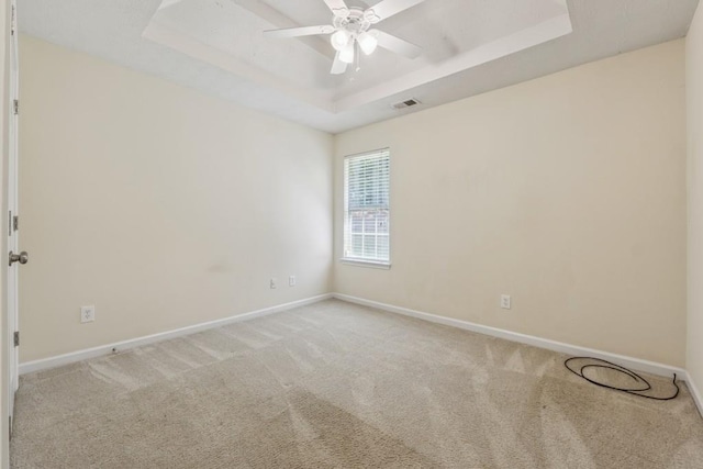 2410 Napa Valley Dr, Villa Rica, GA 30180 - spare room with a raised ceiling, carpet, and ceiling fan