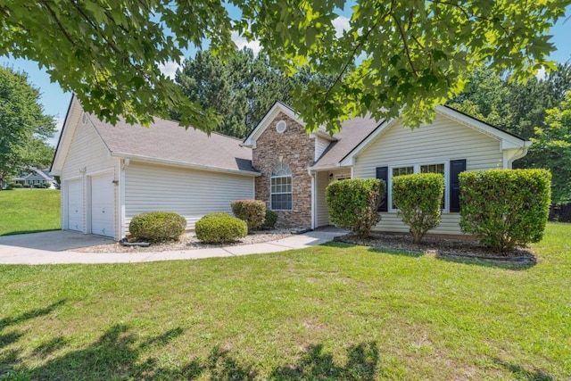 2410 Napa Valley Dr, Villa Rica, GA 30180 - view of front of property featuring a front yard, an attached garage, stone siding, concrete driveway, and roof with shingles