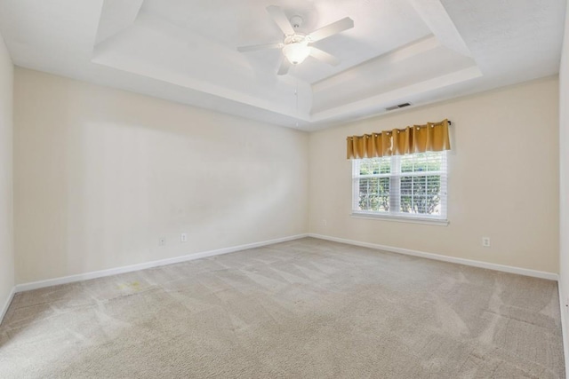 2410 Napa Valley Dr, Villa Rica, GA 30180 - empty room with a raised ceiling, carpet floors, and a ceiling fan