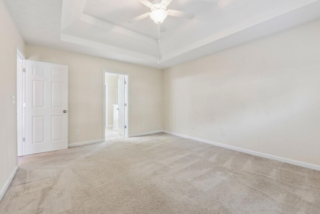 2410 Napa Valley Dr, Villa Rica, GA 30180 - carpeted empty room with a tray ceiling and ceiling fan