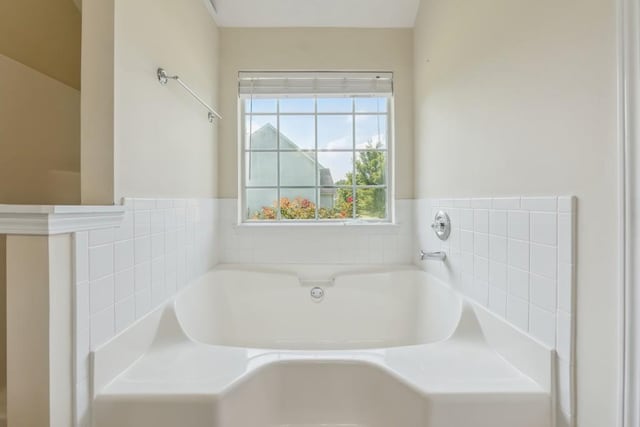2410 Napa Valley Dr, Villa Rica, GA 30180 - full bathroom featuring a garden tub and wainscoting