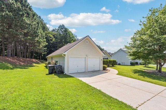 2410 Napa Valley Dr, Villa Rica, GA 30180 - view of home's exterior featuring a detached garage, a lawn, and an outdoor structure