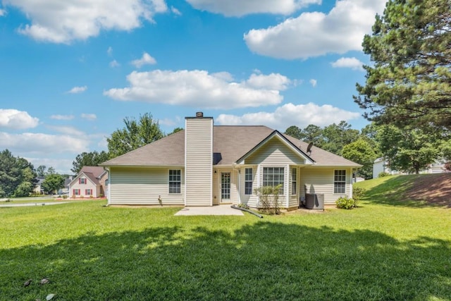 2410 Napa Valley Dr, Villa Rica, GA 30180 - rear view of property featuring a yard, a chimney, and a patio