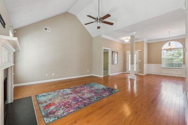 2410 Napa Valley Dr, Villa Rica, GA 30180 - unfurnished living room featuring ornate columns, a ceiling fan, a fireplace with flush hearth, wood finished floors, and lofted ceiling