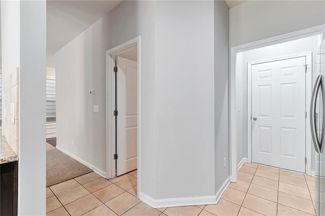 interior space with light tile patterned floors