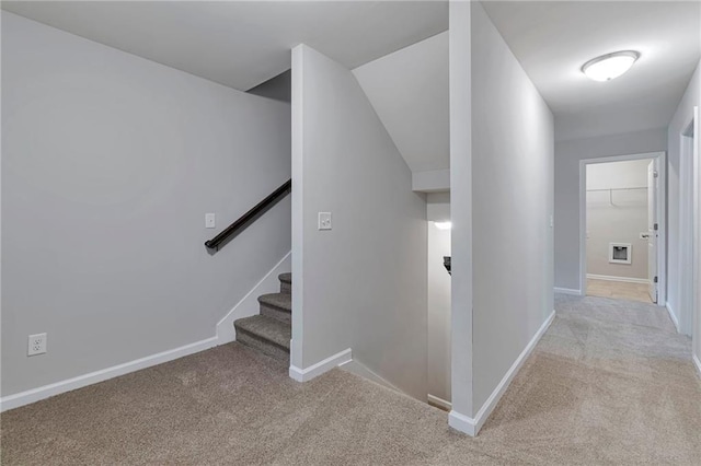 hallway with light carpet