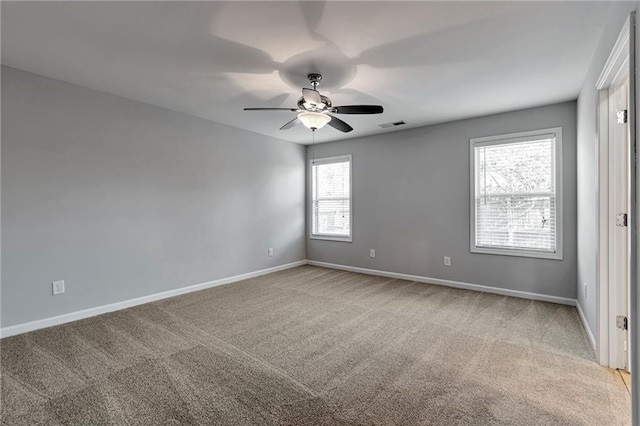 carpeted empty room with ceiling fan