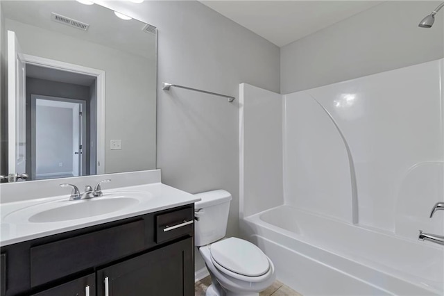 full bathroom featuring tile patterned flooring, vanity, shower / bathtub combination, and toilet