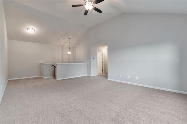 unfurnished living room featuring ceiling fan, light colored carpet, and lofted ceiling