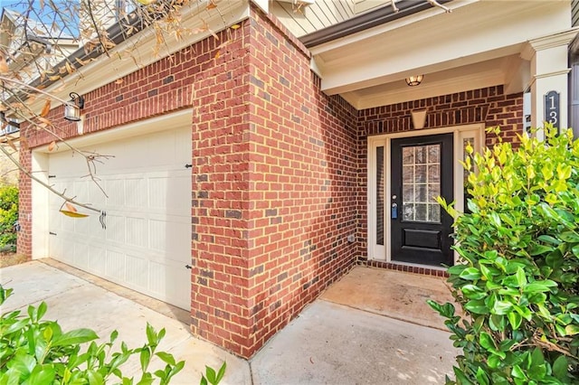 view of exterior entry with a garage