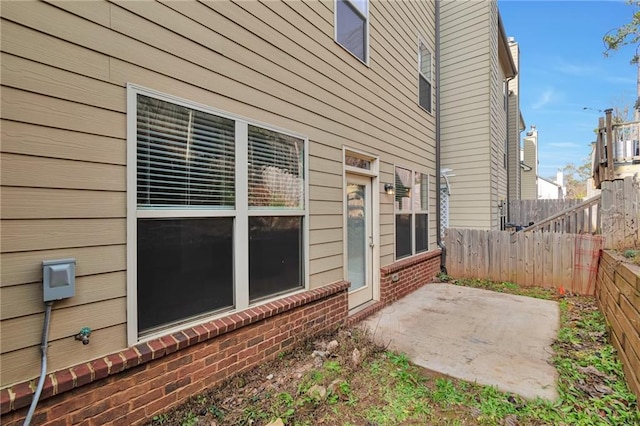 view of side of property with a patio