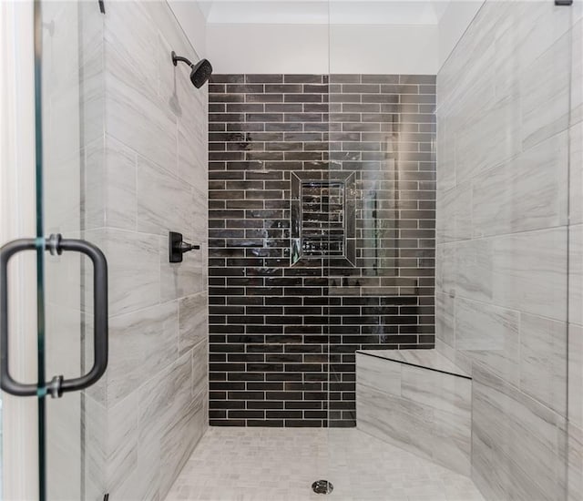 bathroom with a shower stall