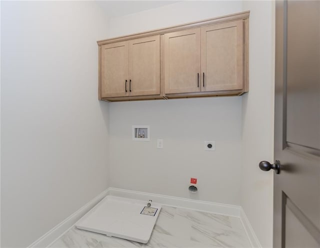 clothes washing area featuring electric dryer hookup, hookup for a washing machine, marble finish floor, and baseboards
