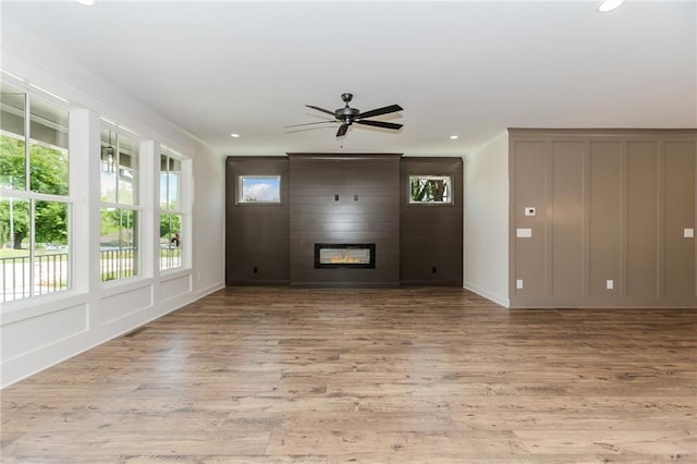 unfurnished living room featuring recessed lighting and wood finished floors