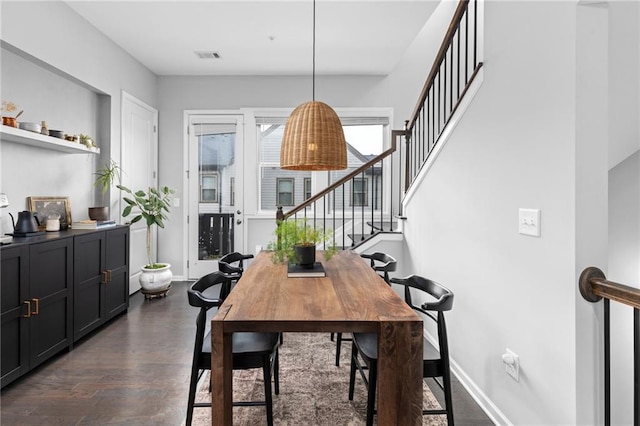 dining room featuring dark hardwood / wood-style flooring