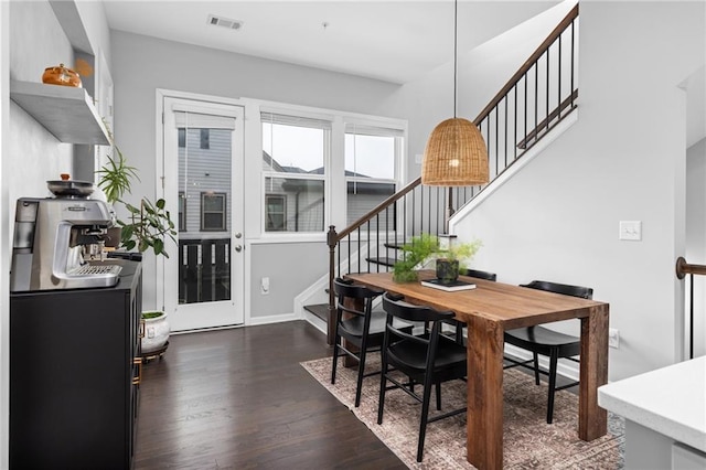 dining room featuring dark hardwood / wood-style flooring