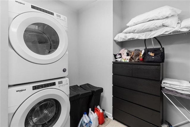 laundry room with stacked washer / dryer