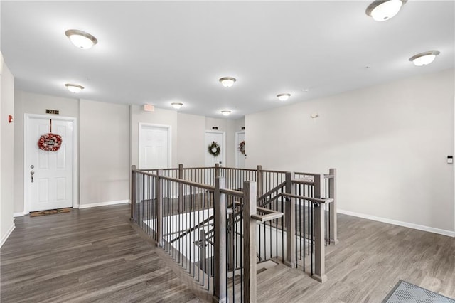 hall with dark hardwood / wood-style flooring