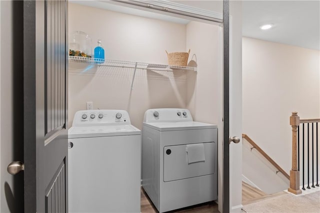clothes washing area featuring independent washer and dryer