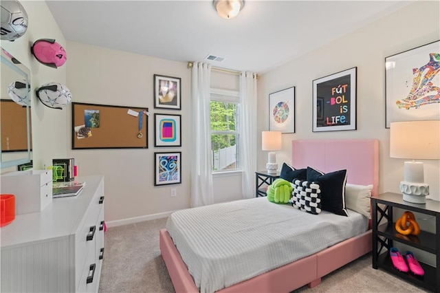 carpeted bedroom featuring baseboards