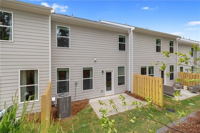 back of property featuring a patio, fence, and cooling unit