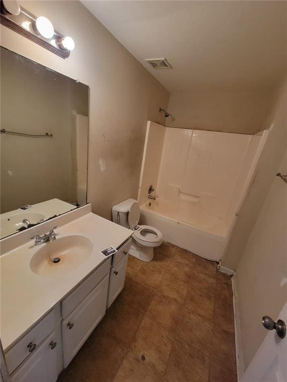 bathroom featuring shower / washtub combination, visible vents, vanity, and toilet