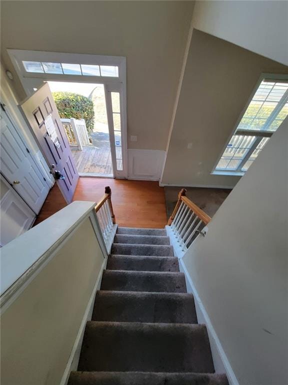 stairway with wood finished floors