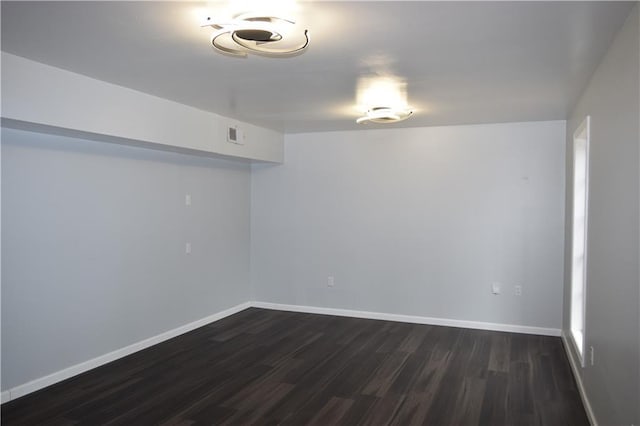 basement featuring dark wood-type flooring