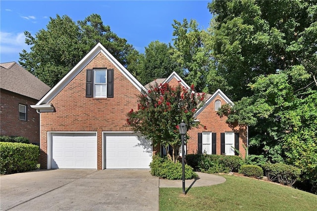 front facade featuring a front yard and a garage