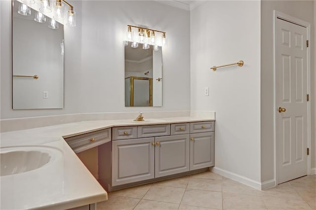 bathroom with crown molding, vanity, tile patterned flooring, and a shower with door