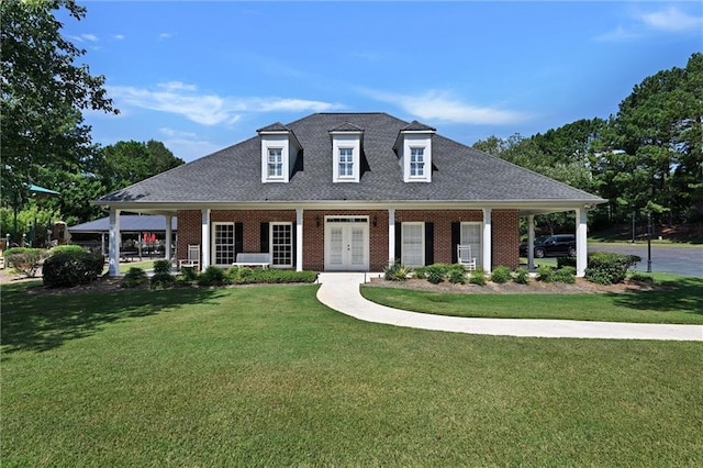 view of front of property with a front yard and a porch