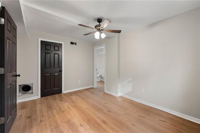 unfurnished bedroom with ceiling fan and light wood-type flooring