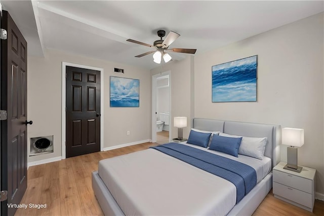 bedroom featuring ensuite bath, ceiling fan, and hardwood / wood-style flooring