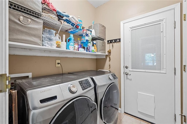 139 Mountain Vista Blvd, Canton, GA 30115 - laundry area with washing machine and clothes dryer and light tile patterned floors