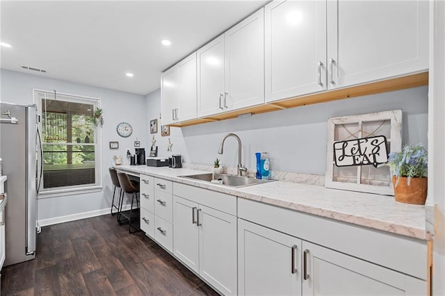 139 Mountain Vista Blvd, Canton, GA 30115 - kitchen featuring a sink, freestanding refrigerator, dark wood-style floors, white cabinetry, and recessed lighting