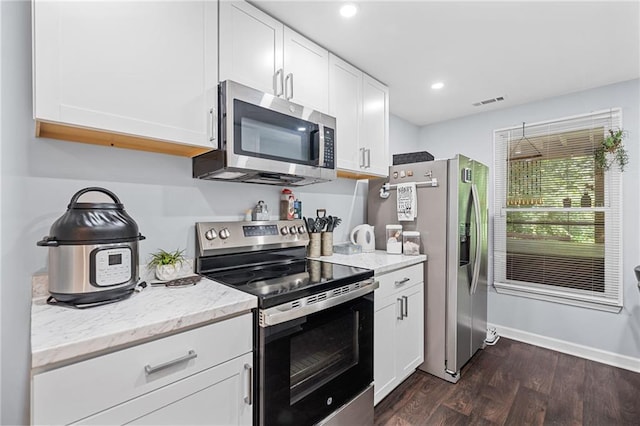 139 Mountain Vista Blvd, Canton, GA 30115 - kitchen featuring stainless steel appliances, dark wood-style floors, white cabinetry, light stone counters, and recessed lighting