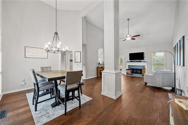 139 Mountain Vista Blvd, Canton, GA 30115 - dining space featuring high vaulted ceiling, a ceiling fan, a chandelier, baseboards, and a fireplace