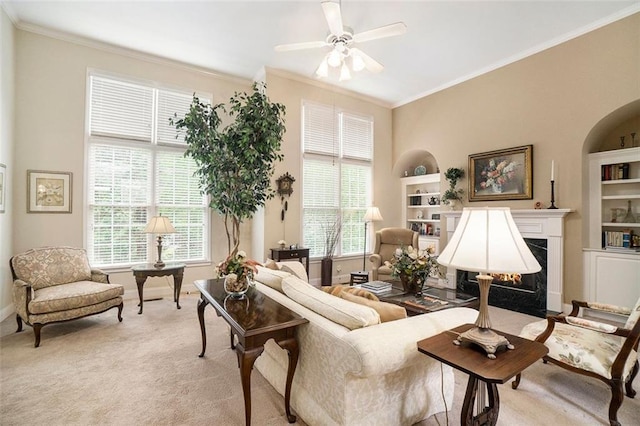 4653 Glory Maple Trce, Powder Springs, GA 30127 - living room featuring crown molding, built in features, ceiling fan, light carpet, and plenty of natural light
