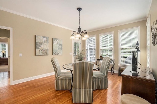 4653 Glory Maple Trce, Powder Springs, GA 30127 - dining room featuring light wood-type flooring, a chandelier, and ornamental molding