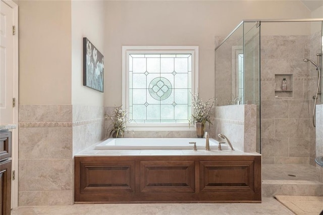 4653 Glory Maple Trce, Powder Springs, GA 30127 - bathroom featuring a garden tub, a stall shower, and vanity