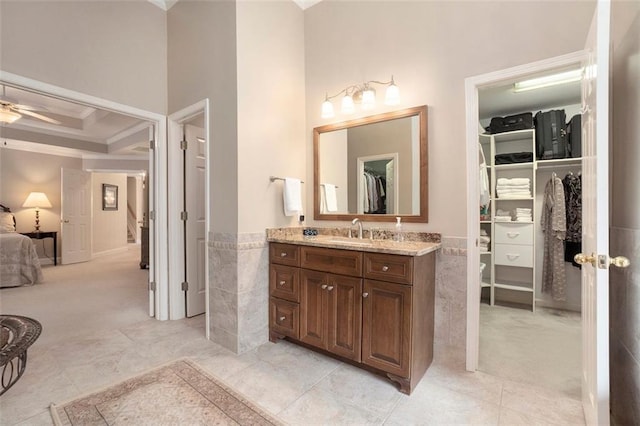 4653 Glory Maple Trce, Powder Springs, GA 30127 - full bathroom featuring ornamental molding, a walk in closet, vanity, connected bathroom, and wainscoting