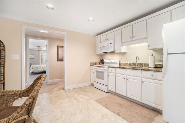 4653 Glory Maple Trce, Powder Springs, GA 30127 - kitchen featuring white appliances, white cabinetry, dark stone counters, ornamental molding, and recessed lighting